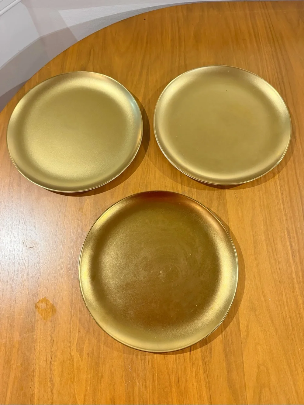 Set of three gold West Elm Plates